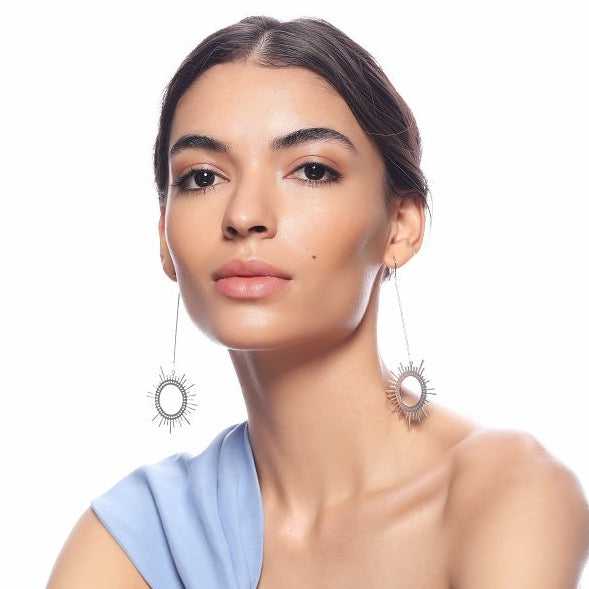 Silver Sun Dangler Earrings by FASHKA, front view.