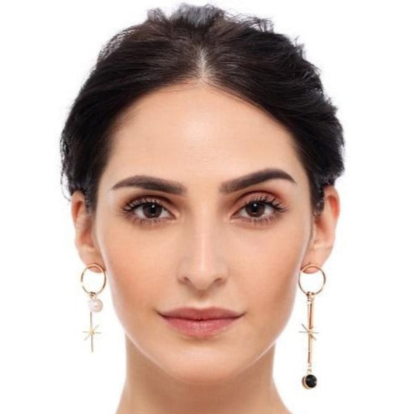 Sun and Moon Mismatch Dangler Earrings by FASHKA, model pose, front view.